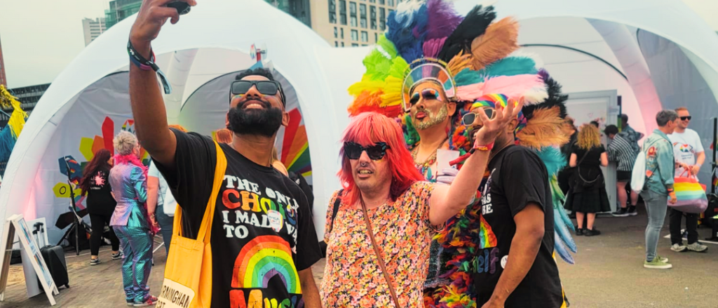 Komplex Community client enjoying Wolverhampton Pride 2025, laughing and interacting with the crowd, celebrating identity, inclusion, and self-expression